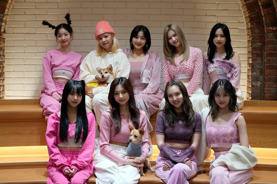 South Korean K-pop group TWICE poses for a photo after an interview in Seoul, South Korea, Wednesday, Nov. 10, 2021. TWICE, the nine-member K-pop band with over nine million Twitter followers, says they feel the growing popularity of the band and K-pop overseas. (AP Photo/Lee Jin-man)