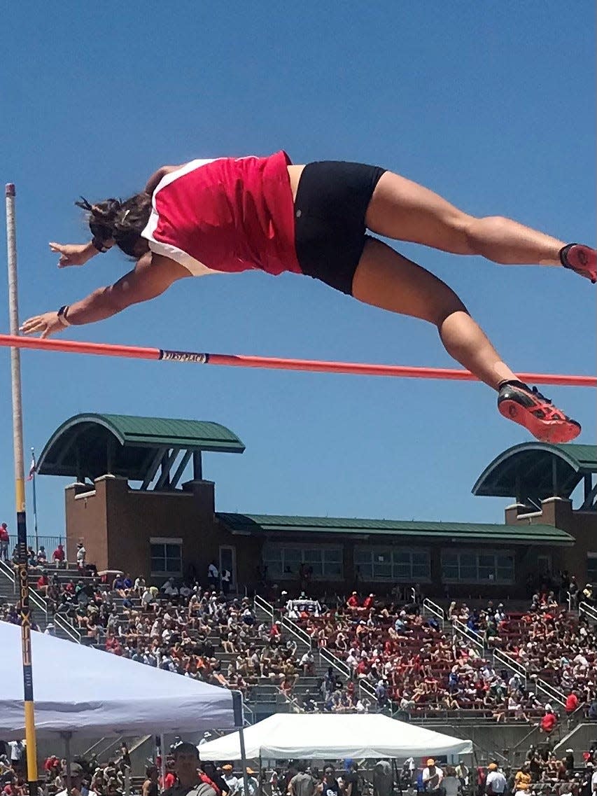 Elgin senior Tiffany Hix clears the bar during the Division III girls state pole vault competition this year at Ohio State's Jesse Owens Memorial Stadium. Hix also went to state twice as a gymnast.