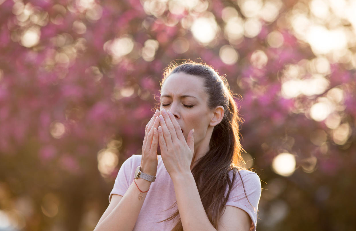 Woman sneezing