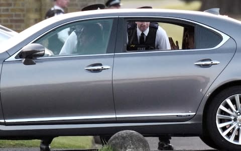 George and Amal Clooney had a 10 minute wait to get into the grounds of Frogmore House - Credit: w8media