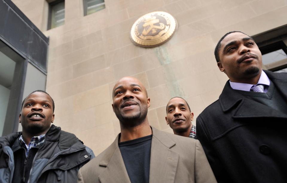 Harold Richardson, left, Vincent Thames, second from left, Terrill Swift, and Michael Saunders, right, pose for a photo on Jan. 17, 2012, after a hearing in Chicago for the four men known as "the Englewood Four," whose 1994 rape and murder convictions were overturned in November 2011.