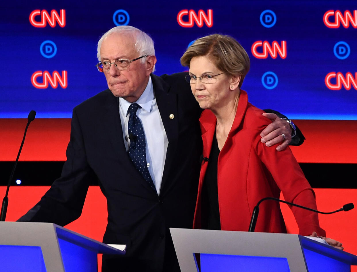 Sen. Bernie Sanders (left) shares a moment with Sen. Elizabeth Warren before the Democratic presidential debate in Detroit in July. The two have been co-endorsed by Common Defense. (Photo: BRENDAN SMIALOWSKI via Getty Images)