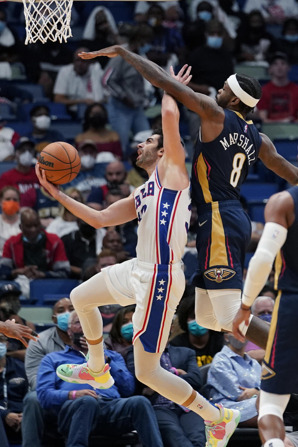 Philadelphia 76ers guard Furkan Korkmaz goes to the basket against New Orleans Pelicans forward Naji Marshall (8) in the second half of an NBA basketball game in New Orleans, Wednesday, Oct. 20, 2021. The 76ers won 117-97. (AP Photo/Gerald Herbert)