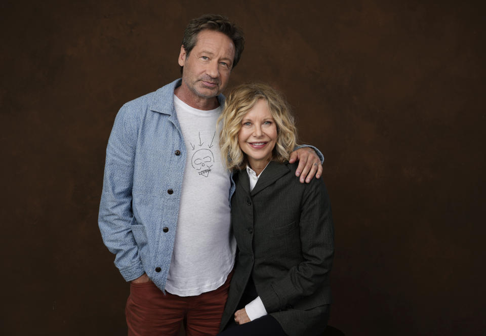 Actor-director Meg Ryan, right, poses with co-star David Duchovny at the Four Seasons Hotel in Los Angeles on Wednesday, Oct. 25, 2023, to promote their film "What Happens Later." (AP Photo/Chris Pizzello)