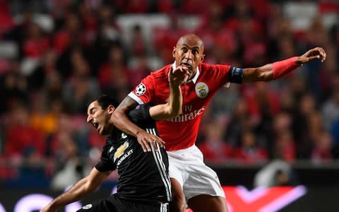 Luisao is booked for catching Mkhitaryan across the throat with his arm  - Credit: FRANCISCO LEONG/AFP