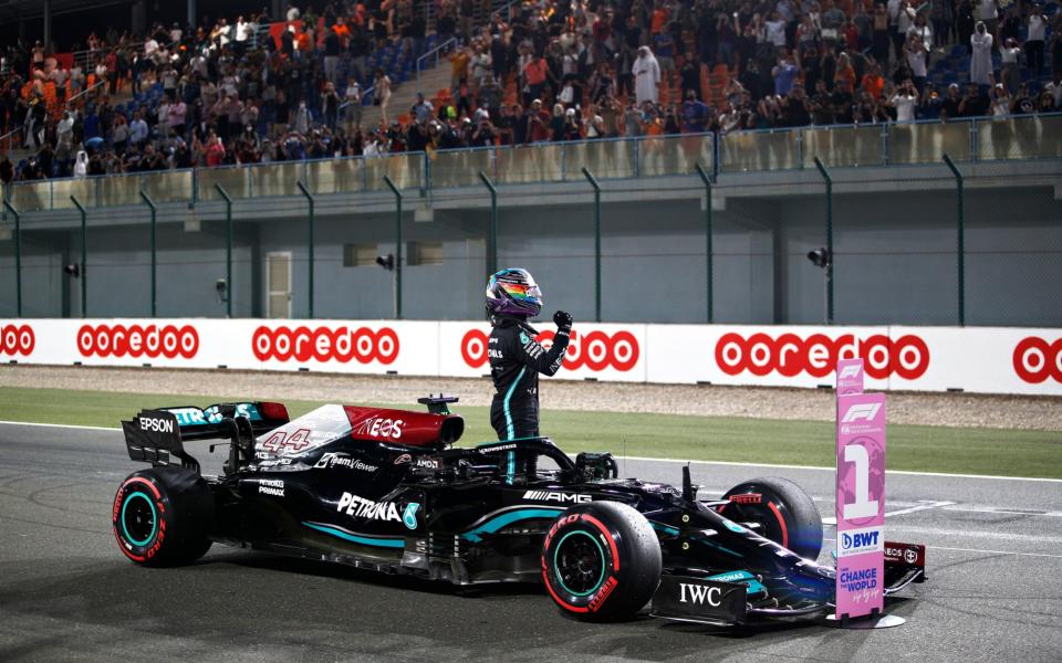 Pole position qualifier Lewis Hamilton of Great Britain and Mercedes GP celebrates in parc ferme during qualifying ahead of the F1 Grand Prix of Qatar at Losail International Circuit on November 20, 2021 in Doha, Qatar - Hamad I Mohammed - Pool/Getty Images