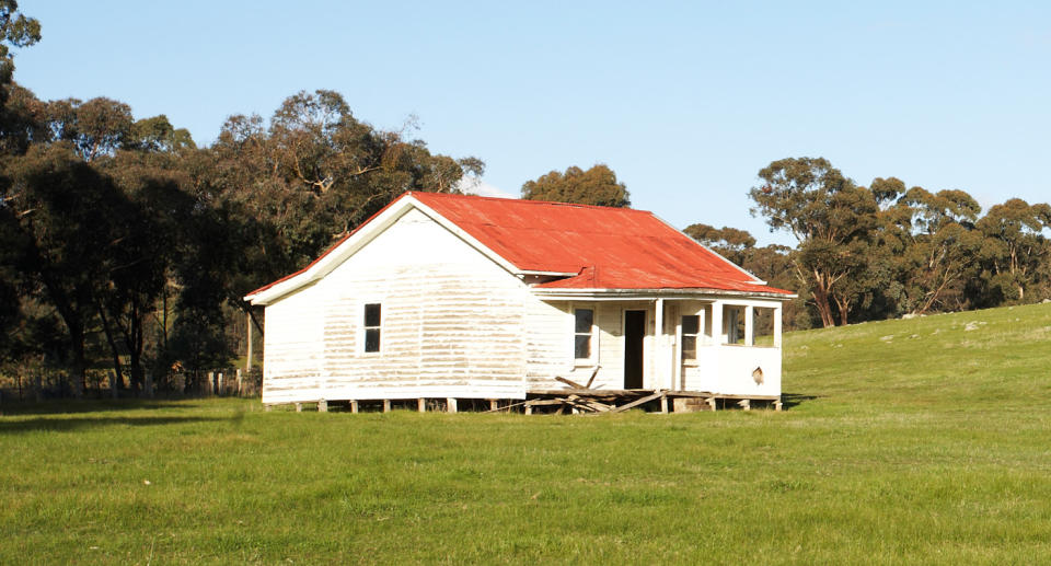 White house on property in Victoria. 