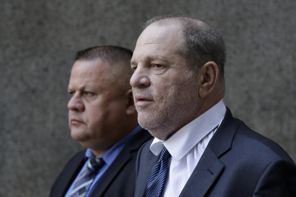 Former movie mogul Harvey Weinstein, right, leaves State Supreme Court following a hearing related to his sexual assault case, Thursday, July 11, 2019, in New York. Weinstein's lawyer Jose Baez went to court Thursday to get a judge's permission to leave the case, the latest defection from what was once seen as a modern version of O.J. Simpson's "dream team" of attorneys. (AP Photo/Seth Wenig)