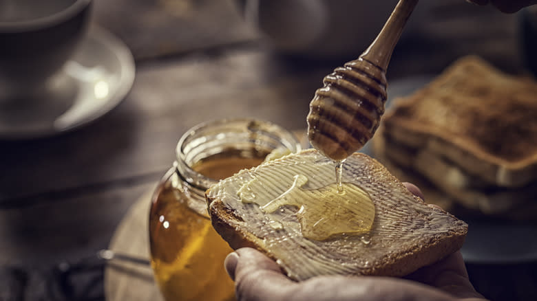 Drizzling honey on toast