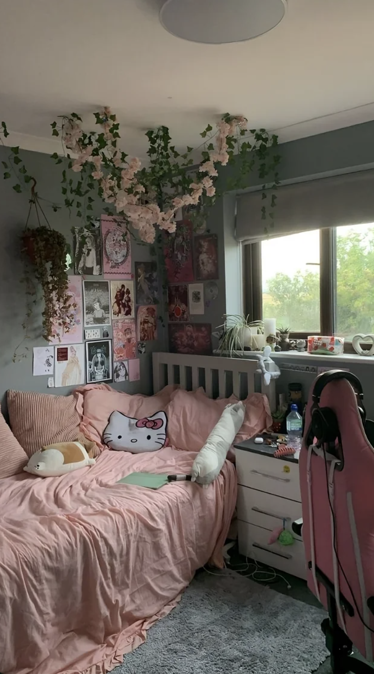 This user's Hello Kitty-themed room features a Hello Kitty pillow and a pink, green, and white color scheme