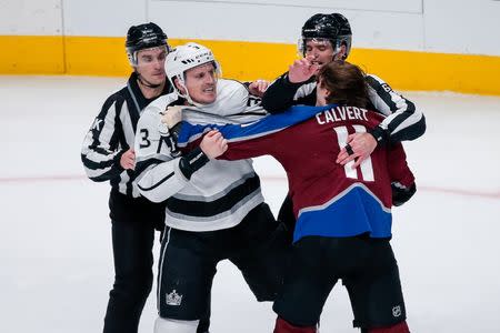 Jan 19, 2019; Denver, CO, USA; Linesman Travis Gawryletz (67) and linesman Brandon Gawryletz (64) break up Colorado Avalanche left wing Matt Calvert (11) and Los Angeles Kings defenseman Dion Phaneuf (3) as they fight in the third period at the Pepsi Center. Mandatory Credit: Isaiah J. Downing-USA TODAY Sports