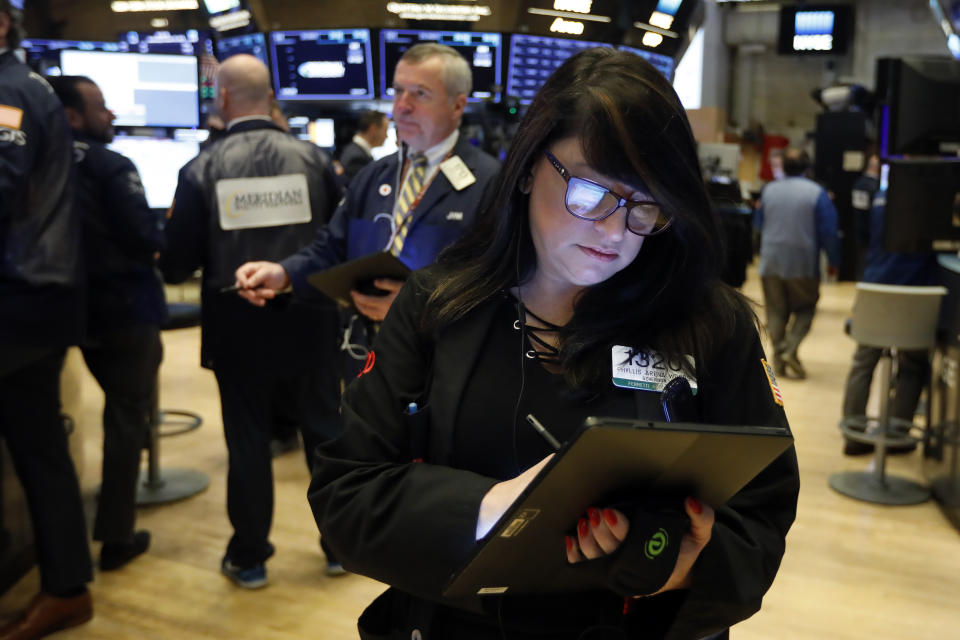 FILE - In this Oct. 30, 2019, file photo trader Phyllis Arena Woods works on the floor of the New York Stock Exchange. The U.S. stock market opens at 9:30 a.m. EST on Tuesday, Nov 5. (AP Photo/Richard Drew, File)