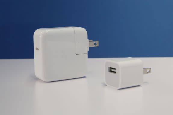 Apple's 29-watt USB-C fast charger (left) vs. regular 5-watt USB-A charger that's included with every iPhone (right).