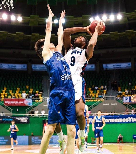 Team USA and CVCA guard Darryn Peterson takes a shot over Uruguay's Santiago Tricot during the quarterfinals of the U16 FIBA Americas championship.