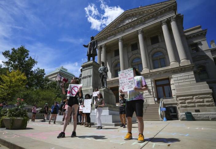 Abortion rights protesters protest outside the Indiana Statehouse during the ongoing special session on Friday, July 29, 2022 in Indianapolis.  (Jenna Watson/The Indianapolis Star via AP)