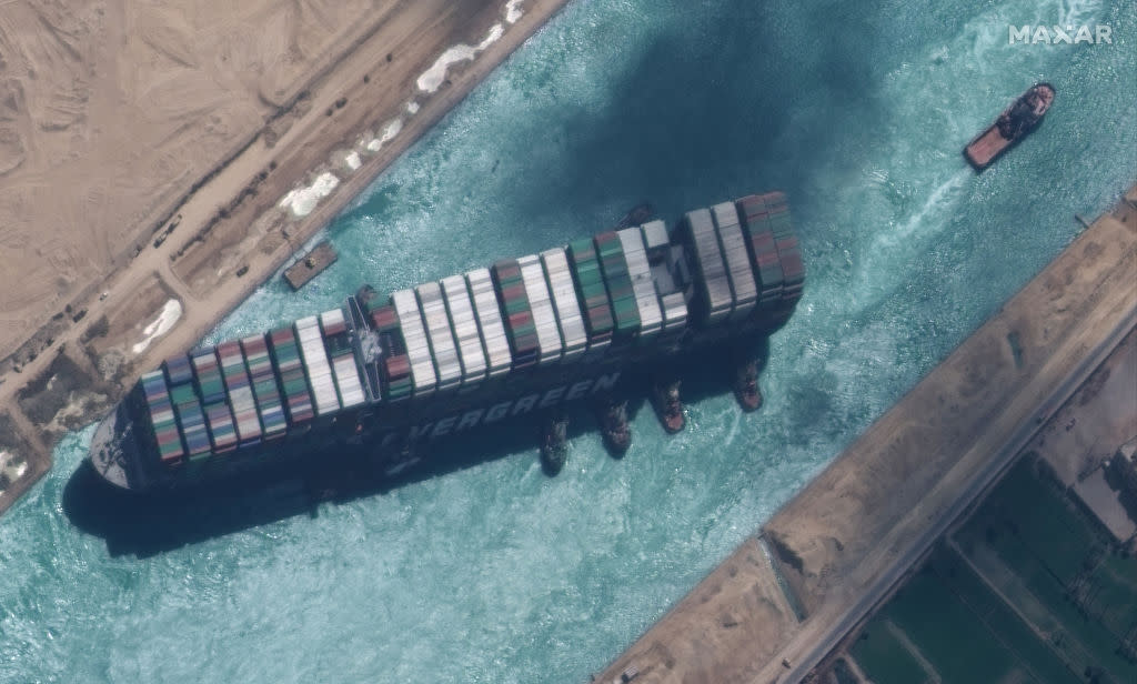 STUCK SHIP EVER GIVEN, SUEZ CANAL -- MARCH 29, 2021:  Maxar new high-resolution satellite imagery of the Suez canal and the container ship (EVER GIVEN) and tugboats that have the ship nearly unstuck north of the city of Suez, Egypt.