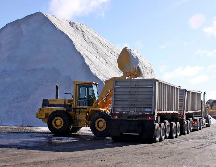 A front end loader and truck loads up salt at the Carbide Dock in Sault Ste. Marie.