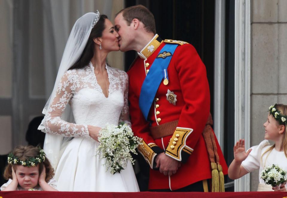 <p>Just after <a href="https://www.townandcountrymag.com/the-scene/weddings/g20052313/kate-middleton-prince-william-royal-wedding-2011-photos/" rel="nofollow noopener" target="_blank" data-ylk="slk:their royal wedding;elm:context_link;itc:0;sec:content-canvas" class="link ">their royal wedding</a>, Kate and Will kiss for the crowd. <br></p>