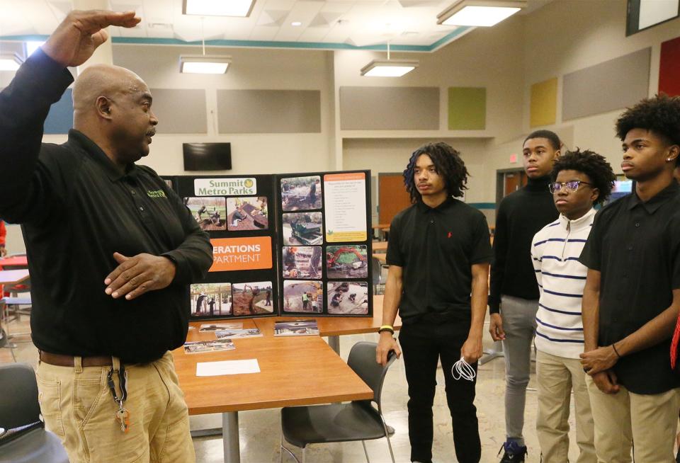 Jerry Harris of Summit Metro Parks talks with Mario Jones, 16, Julius Simon, 15, D.J. Robinson, 15, about working for the park during a recent resume writing and interview workshop at Firestone high school in Akron.