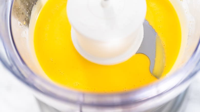 Chef blending ingredients in a bowl