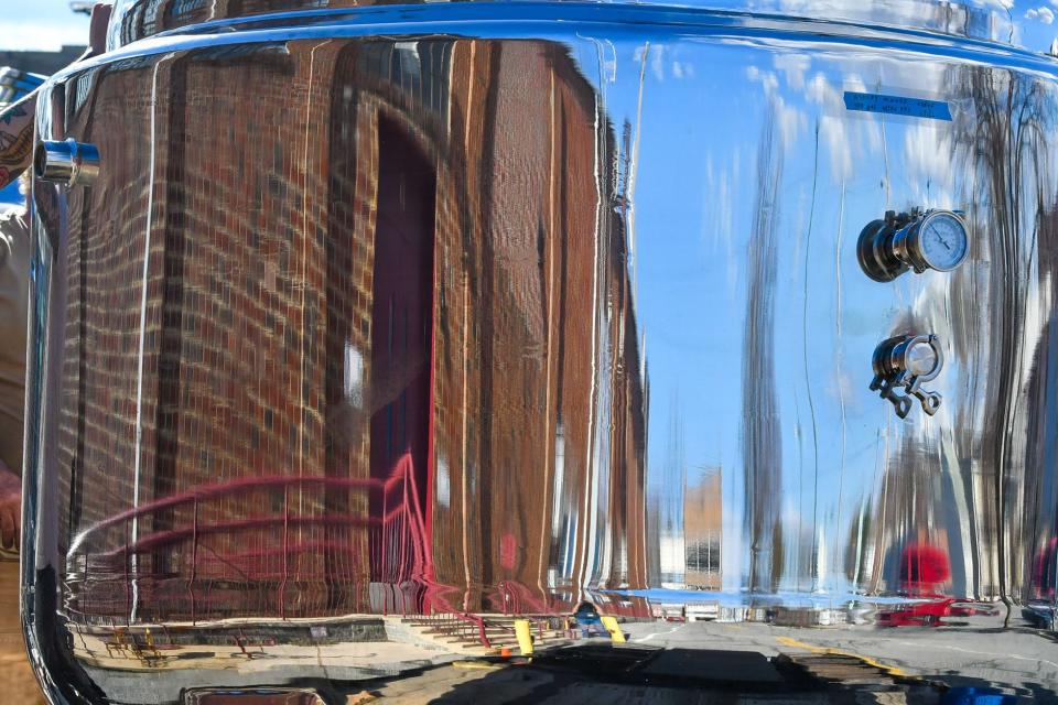 The former City Farmers Market building is reflected in a kettle that will be used at Hub City Brewery. The equipment was delivered last year.