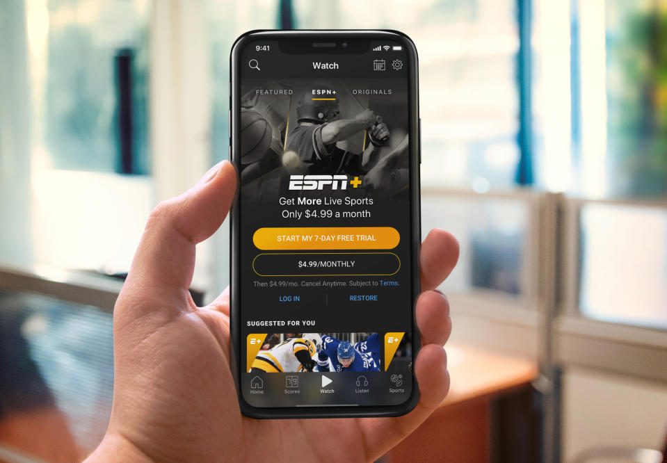 A phone shows ESPN+