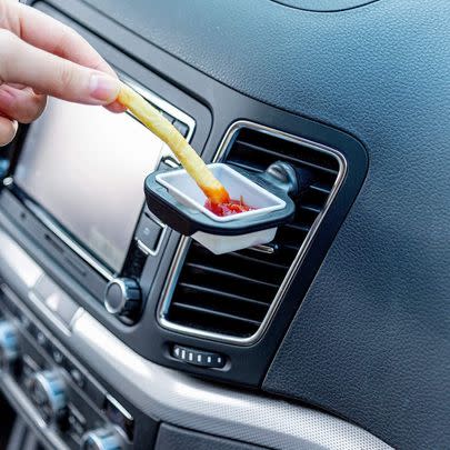 Check out these sauce holders that can be clipped onto the vents in your car.