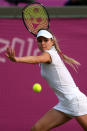 LONDON, ENGLAND - JULY 31: Maria Kirilenko of Russia returns a shot against Heather Watson of Great Britain during the second round of Women's Singles Tennis on Day 4 of the London 2012 Olympic Games at Wimbledon on July 31, 2012 in London, England. (Photo by Clive Brunskill/Getty Images)