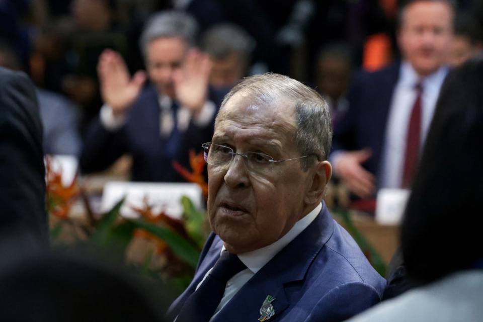 Russian foreign minister Sergei Lavrov, with David Cameron (right) and US secretary of state Antony Blinken in the background (Reuters)