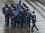 Hong Kong police show their new goose step marching style on the National Security Education Day at a police school in Hong Kong Thursday, April 15, 2021. Authorities marked the event with a police college open house, where police personnel demonstrated the Chinese military’s goose step march, replacing British-style foot drills from the time Hong Kong was ruled by the U.K. until the 1997 handover to China. (AP Photo/Vincent Yu)