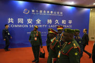 Foreign military delegates arrive for the 10th Beijing Xiangshan Forum in Beijing, Tuesday, Oct. 31, 2023. Singapore's defense minister Ng Eng Hen called on China, as a dominant power in Asia, to take the lead in reducing tensions by being a benevolent one, warning that military conflict like the wars in Ukraine and Gaza would be devastating to the region's future. (AP Photo/Ng Han Guan)