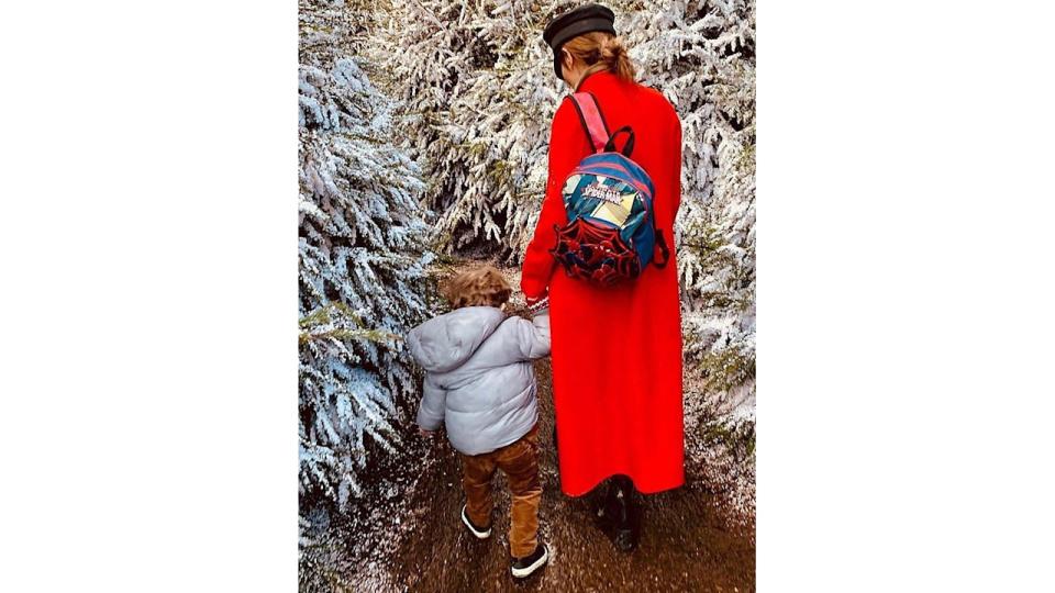 cheryl in snowy trees with bear 