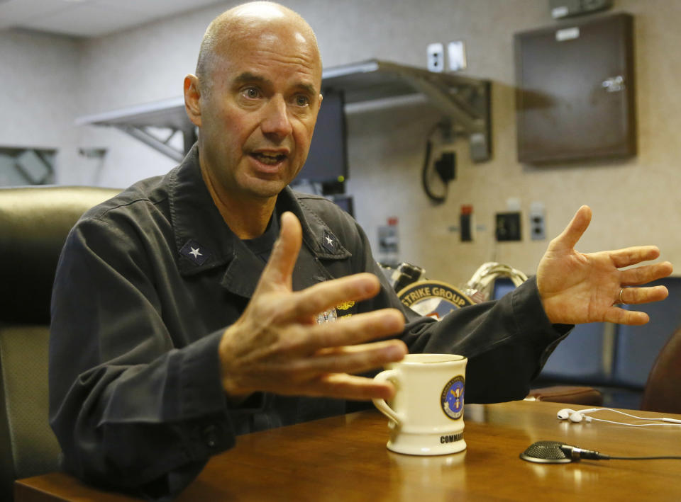 U.S. Navy Rear Admiral James Kilby, Commander, Carrier Strike Group One, talks to the media aboard the U.S. Navy aircraft carrier USS Carl Vinson (CVN 70) while on patrol off the disputed South China Sea, Friday, March 3, 2017. The U.S. military took journalists Friday to the carrier while on patrol off the disputed South China Sea, sending a signal to China and American allies of its resolve to ensure freedom of navigation and overflight in one of the world's security hotspots. (AP Photo/Bullit Marquez)