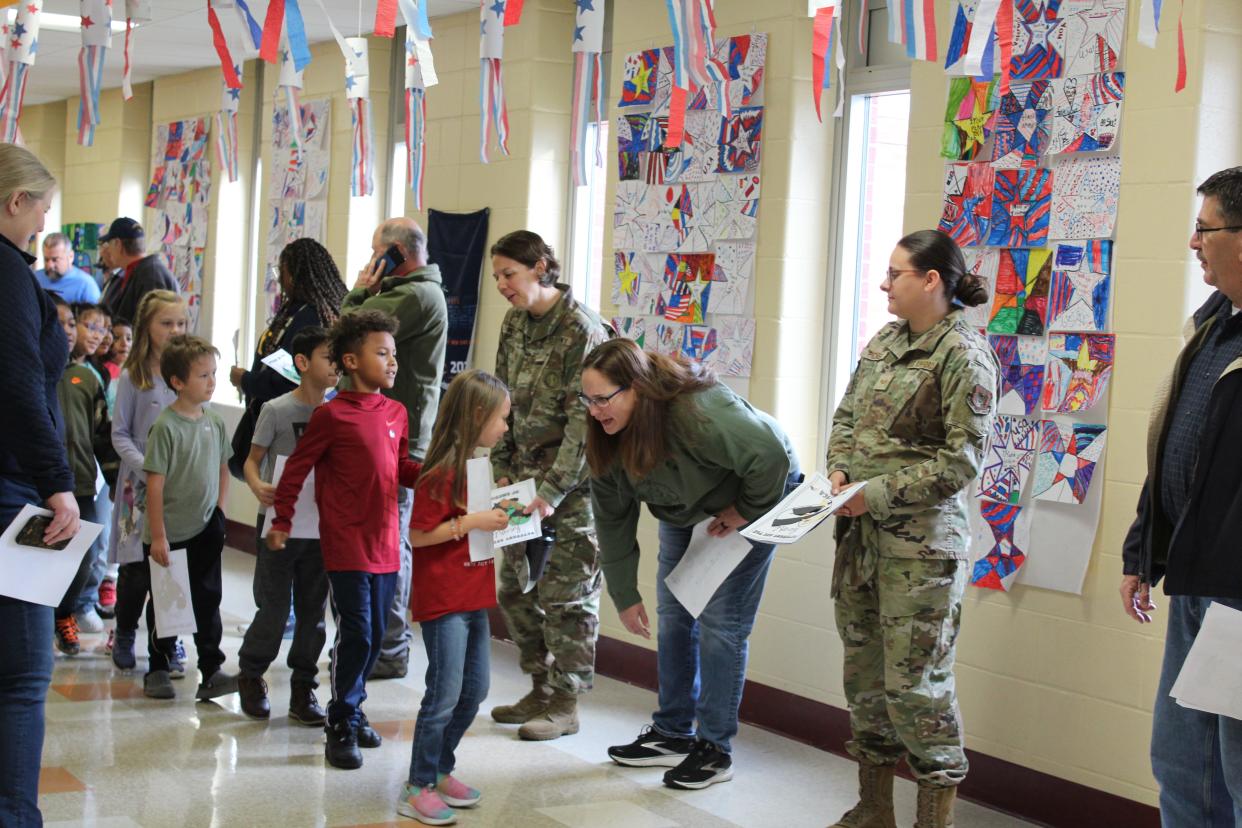South Elementary students give letters of gratitude to veterans and active service members during their November 2023 Veteran’s Day event. South Elementary recently received a Purple Star designation from the state for their work to support military students and families.