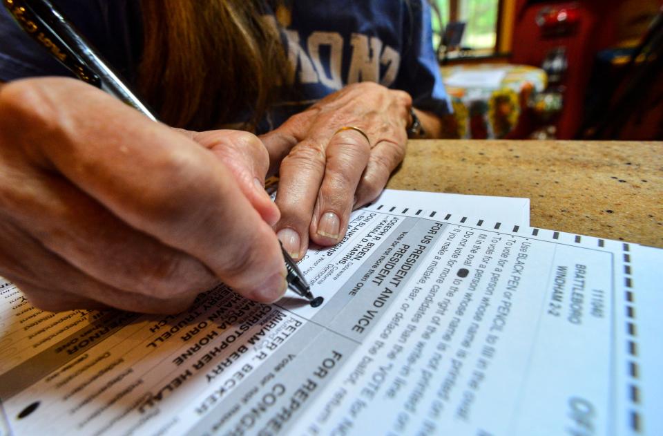 Susan Avery of Brattleboro, Vt., fills out the ballot she received in the mail on Sept. 28.