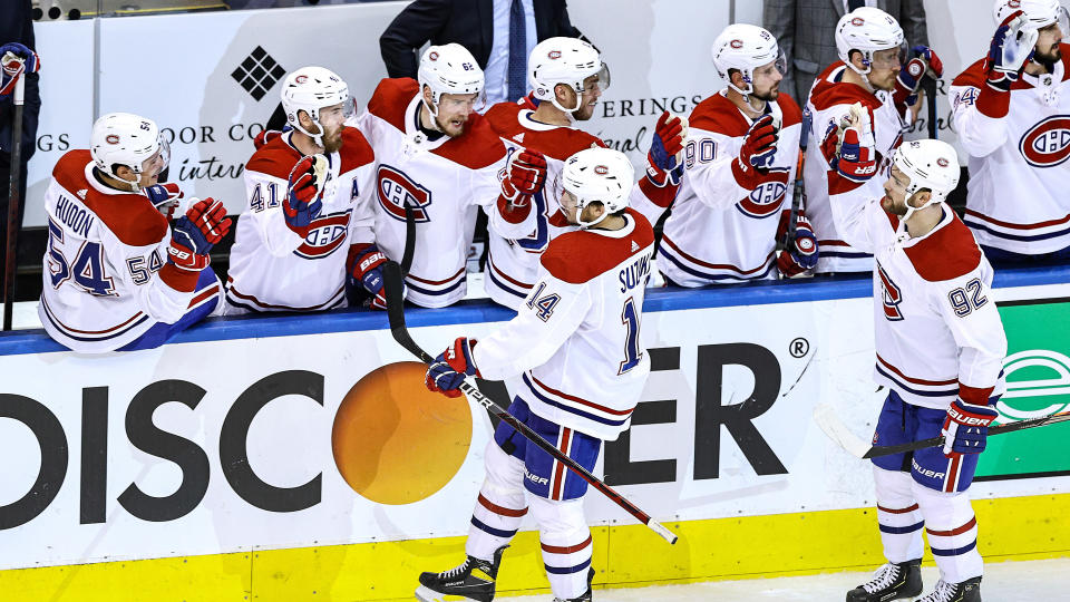 TORONTO, ONTARIO - AUGUST 19:  Nick Suzuki #14 of the Montreal Canadiens celebrates with his teammates after scoring a goal against the Philadelphia Flyers at 10:59 during the third period in Game Five of the Eastern Conference First Round during the 2020 NHL Stanley Cup Playoffs at Scotiabank Arena on August 19, 2020 in Toronto, Ontario. (Photo by Elsa/Getty Images)