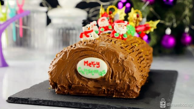 Chocolate and coffee christmas log cake close up