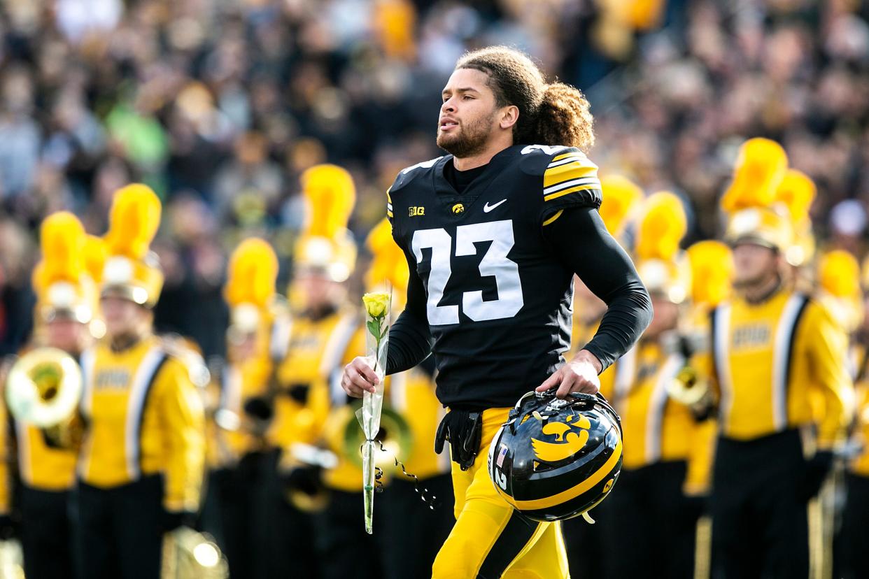Iowa defensive back Xavior Williams (23) is acknowledged during a senior day ceremony before a NCAA Big Ten Conference football game against Illinois, Saturday, Nov. 20, 2021, at Kinnick Stadium in Iowa City, Iowa.