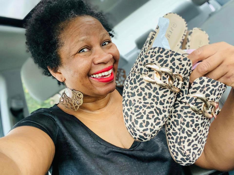 Ang McGriff of Nashville, Tenn., with one of three pairs of $9.99 shoes she bought from the Aldi Finds aisle recently.