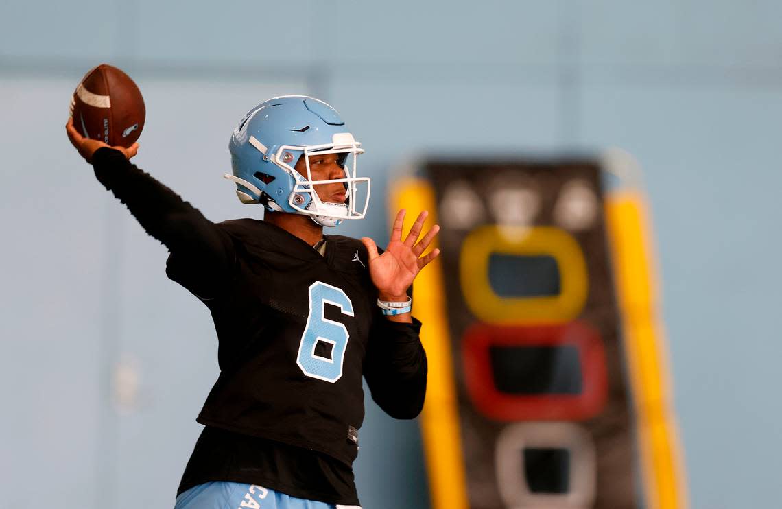 North Carolina quarterback Jacolby Criswell throws a pass during UNC’s first football practice of the season on Friday, July 29, 2022, in Chapel Hill, N.C.
