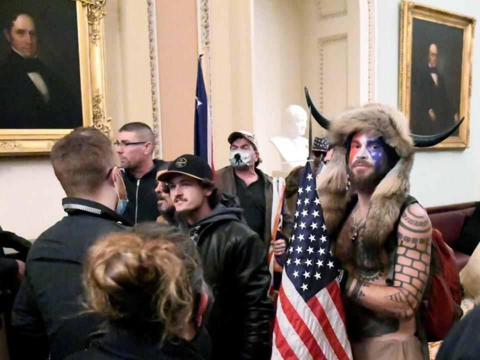 <div class="inline-image__caption"><p>Jacob Chansley on the second floor of the U.S. Capitol on Jan. 6.</p></div> <div class="inline-image__credit">Reuters</div>