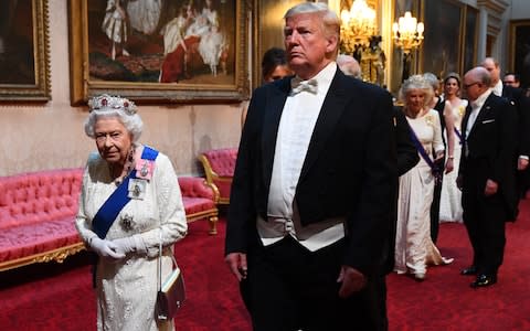 Queen Elizabeth II and U.S. President Donald Trump arrive through the East Gallery for a State Banquet at Buckingham Palace - Credit: Victoria Jones- WPA Pool