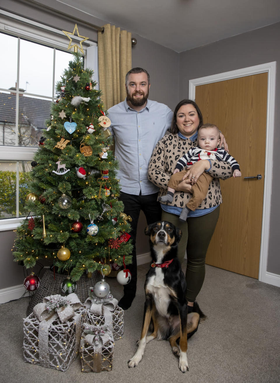 Martin and Gillian Johnston with their son Robbie and their rescue dog Max (Liam McBurney/PA)