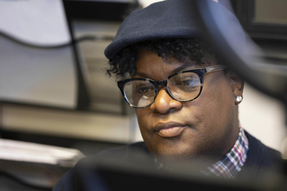 T.J. King, who is an outreach specialist with the Nebraska AIDS Project, is photographed in their office on Thursday, Feb. 23, 2023, in Lincoln, Neb. King came off probation in August after serving time for drug and theft convictions. King’s first chance to vote will be in the 2024 presidential election season -- unless a legislative proposal introduced in January that would remove the two-year requirement passes and becomes law. (AP Photo/Rebecca S. Gratz)