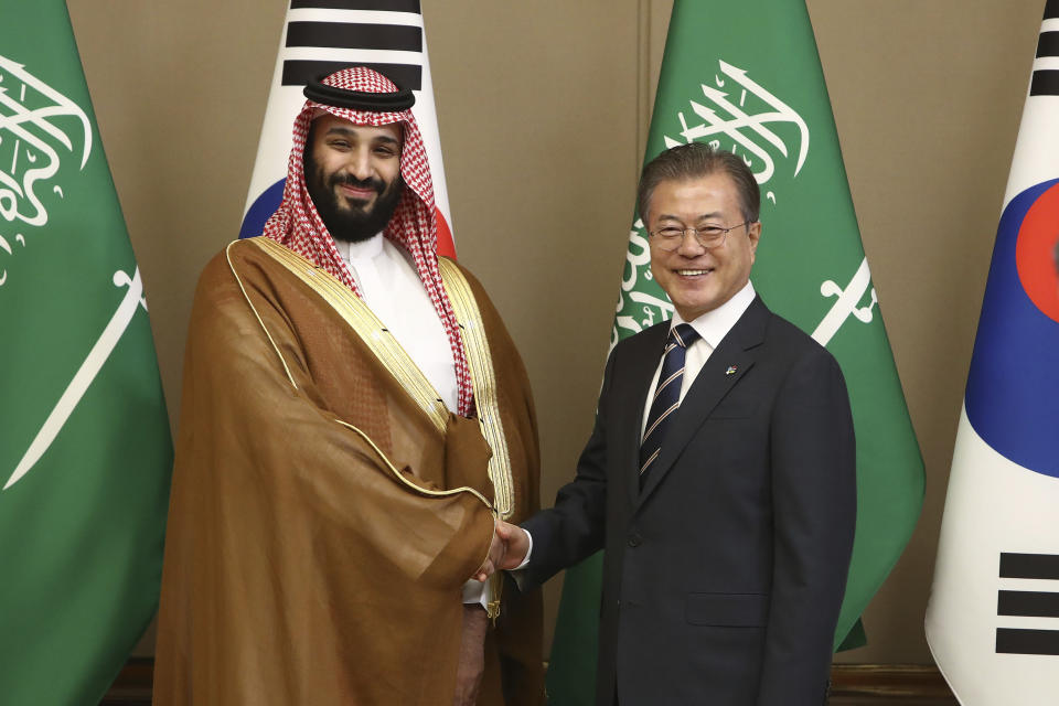 South Korean President Moon Jae-in, right, shakes hands with Saudi Crown Prince Mohammed bin Salman during a meeting at the presidential Blue House, Wednesday, June 26, 2019, in Seoul, South Korea. Bin Salman is visiting South Korea for two days - the first time by an heir to the throne of Saudi Arabia since 1998. (Chung Sung-Jun/Pool Photo via AP)