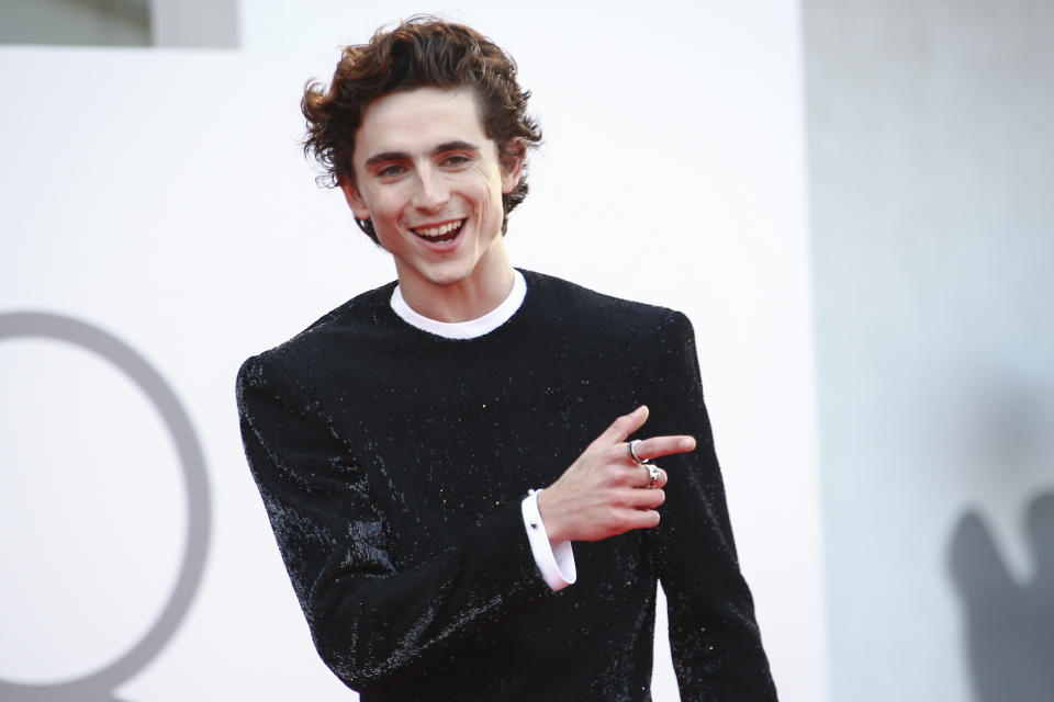 FILE - In this Sept, 3, 2021 file photo Timothee Chalamet poses for photographers upon arrival at the premiere of the film 'Dune' during the 78th edition of the Venice Film Festival in Venice, Italy. All across the Lido, you could see it on the stars' faces: sheer joy. Whether it was Timothee Chalamet's beaming face greeting fans, Oscar Isaac and Jessica Chastain's playfulness for the cameras, Josh Brolin's ear-to-ear grin in the front row of a "Dune" event or those looks exchanged between Jennifer Lopez and Ben Affleck, the 78th International Film Festival mixed elegance and fun in a way rarely seen since early 2020. (Photo by Joel C Ryan/Invision/AP, File)