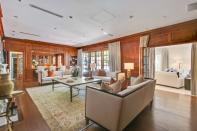 <p>This den has beautiful wood finishings and plenty of natural light. (Sotheby’s International Realty) </p>