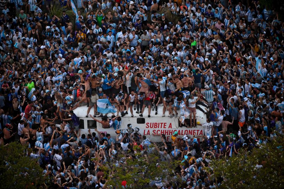 In this aerial view fans of Argentina celebrate winning the Qatar 2022 World Cup against France at 9 de Julio avenue in Buenos Aires, on December 18, 2022. (Photo by Luis ROBAYO / AFP) (Photo by LUIS ROBAYO/AFP via Getty Images)