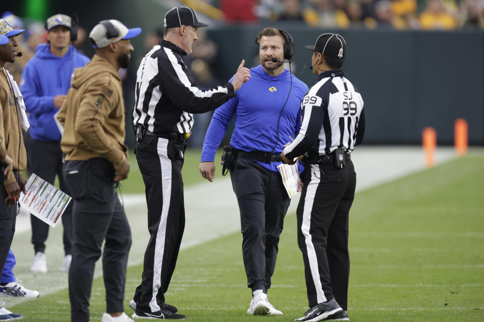 Los Angeles Rams head coach Sean McVay, middle right, talks with referees during the first half of an NFL football game against the Green Bay Packers, Sunday, Nov. 5, 2023, in Green Bay, Wis. (AP Photo/Matt Ludtke)