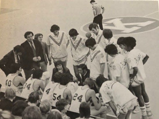 Edward Donohue, center, gives instructions to his Kings College men's basketball team. The Poughkeepsie native was a longtime coach and athletic administrator at the Pennsylvania school.